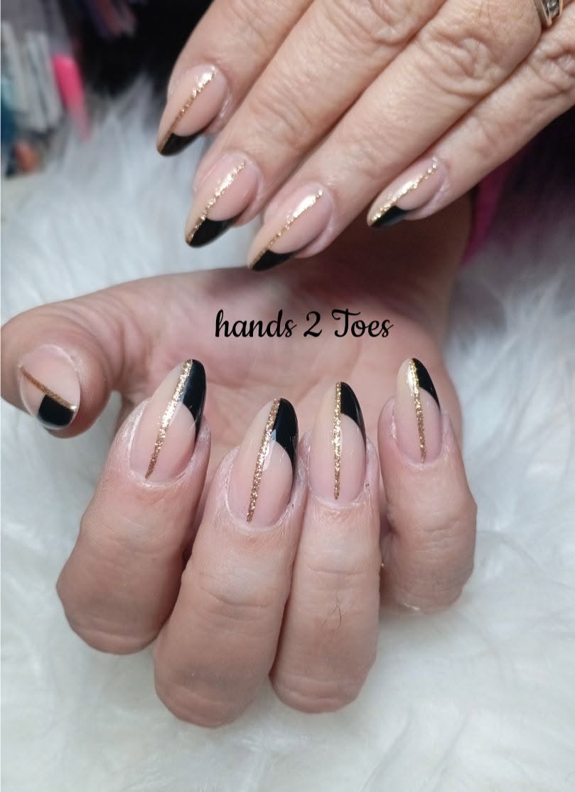 Almond nails with black and rose gold glitter design